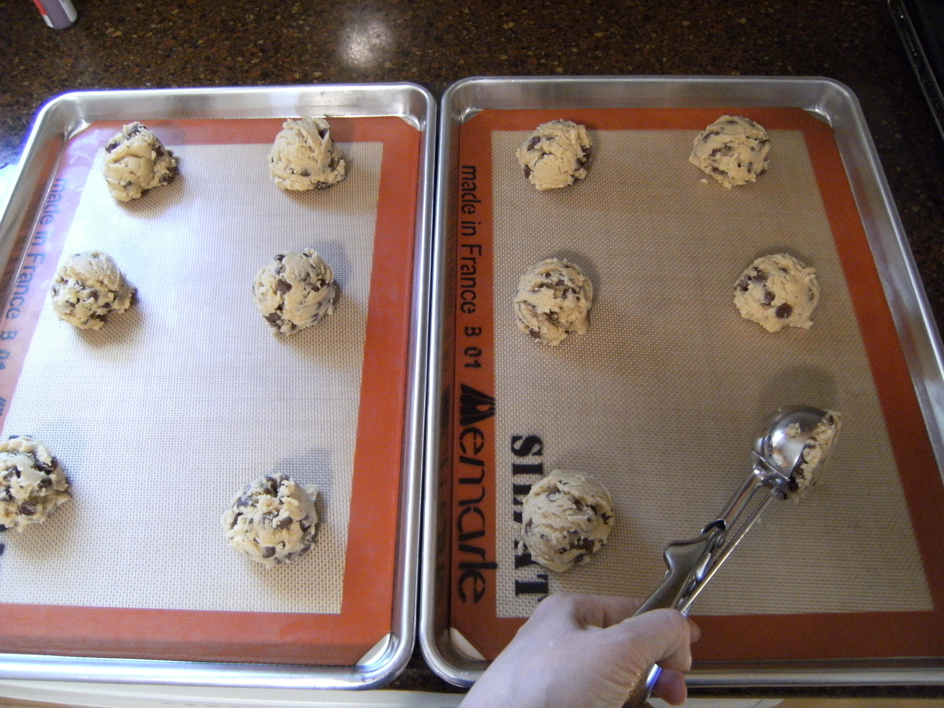 chocolate chip cookie dough on sheet pans