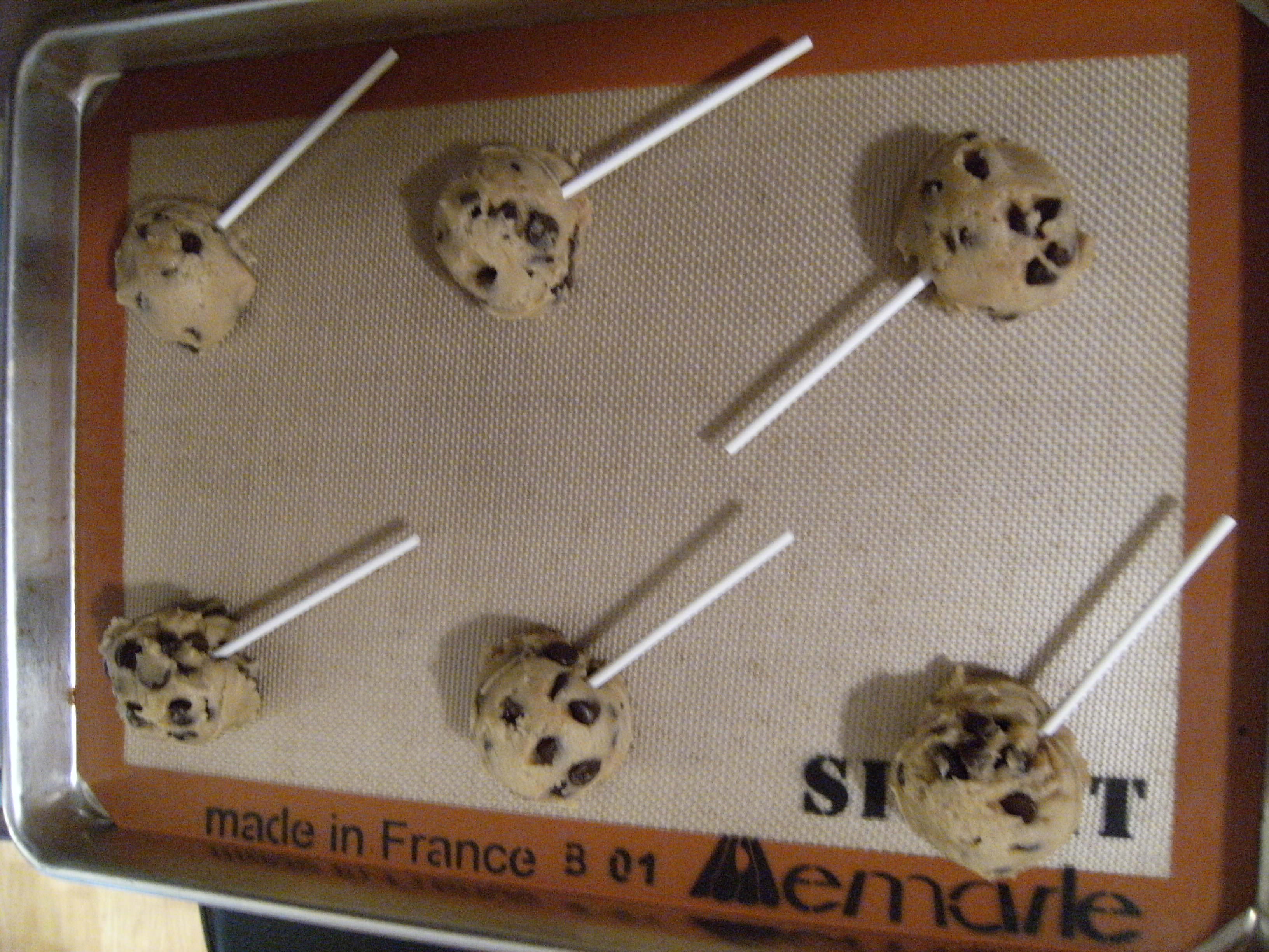 Place lollipop sticks into raw chocolate chip cookie dough and bake them into cookie pops!