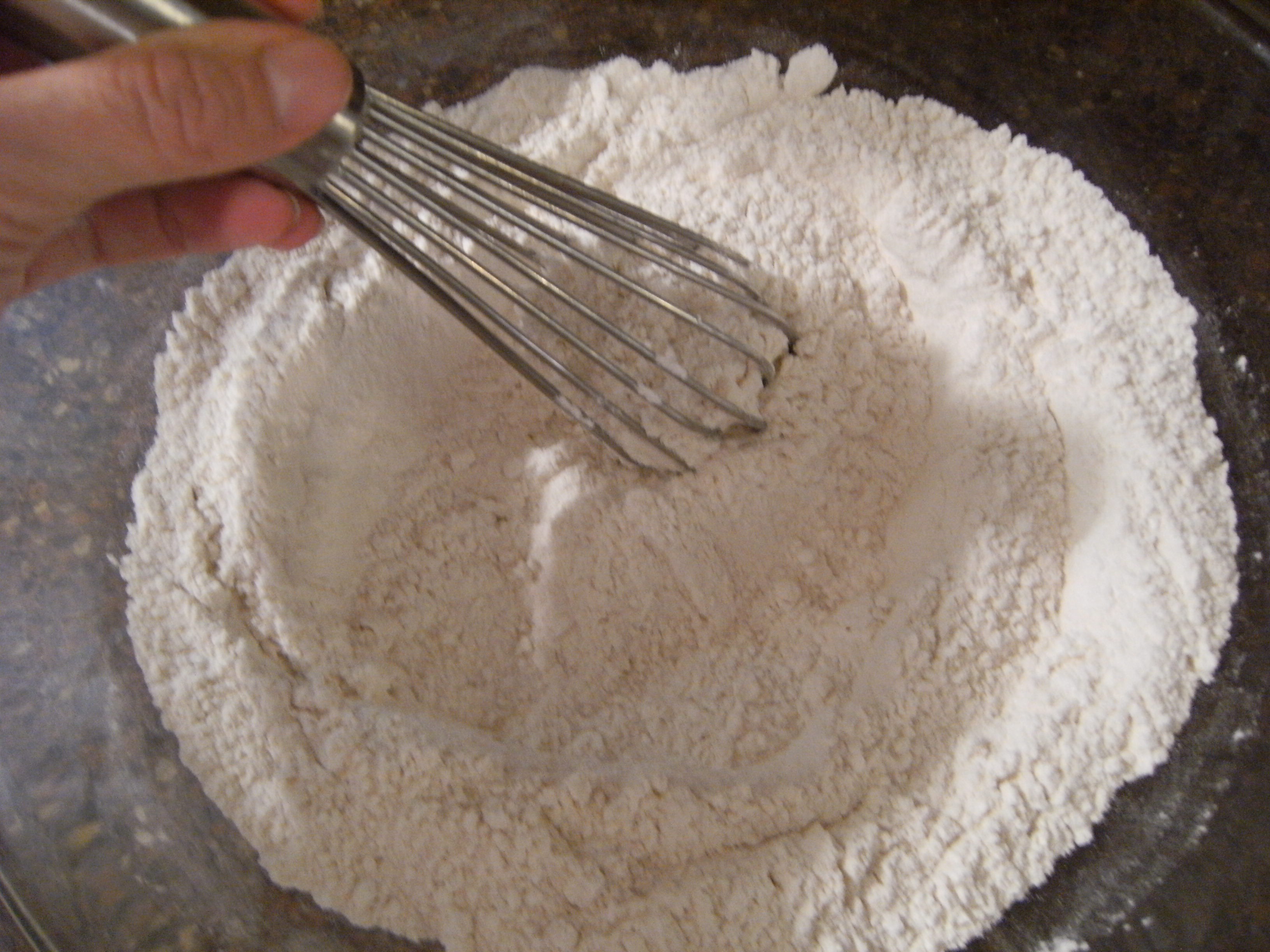 whisking flour for scones