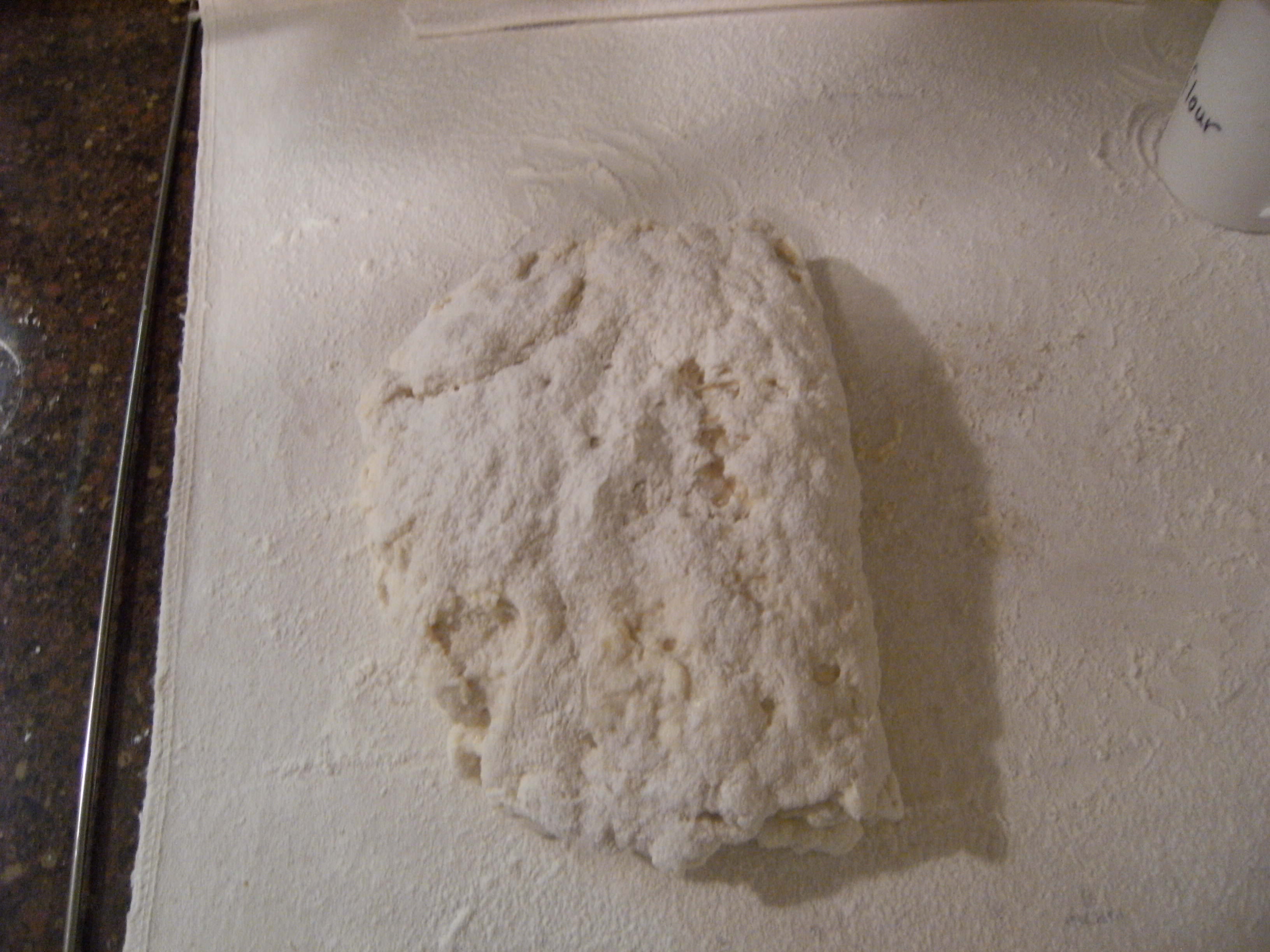 Turning homemade biscuits dough
