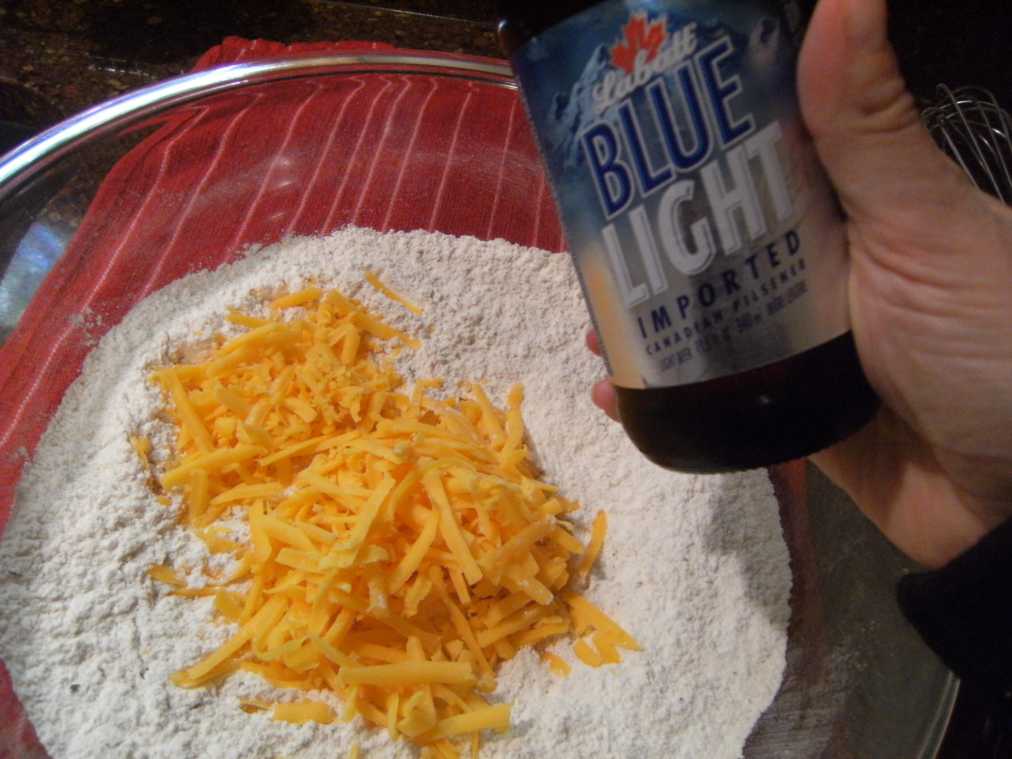 adding beer for cheesy beer bread