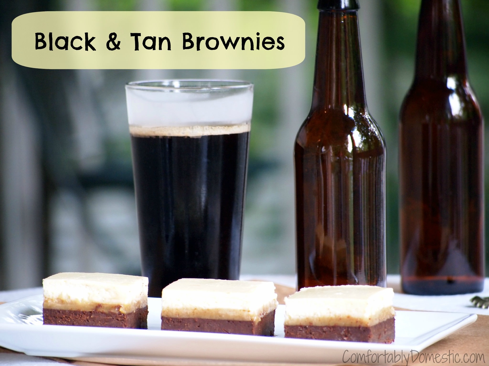 Black and tan brownies are the ultimate brownie treat for beer lovers! A layer of blondies are covered with stout infused brownies and a thick cheesecake layer sits on top. | ComfortablyDomestic.com