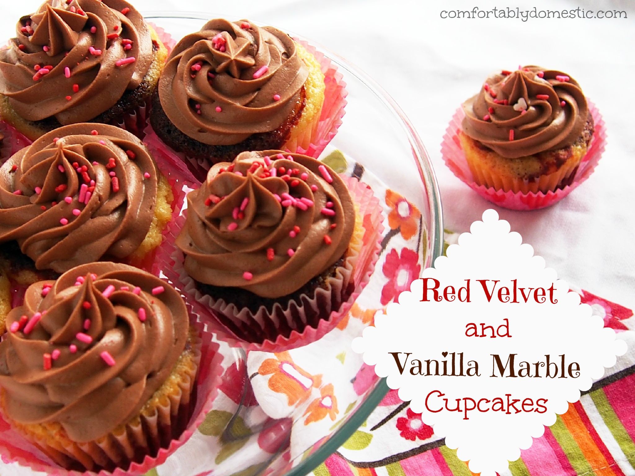 Red Velvet Vanilla Marble Cupcakes are a delicious combination of red velvet cake, marbled with moist vanilla cake. Topped with creamy, rich milk chocolate buttercream frosting. | ComfortablyDomestic.com
