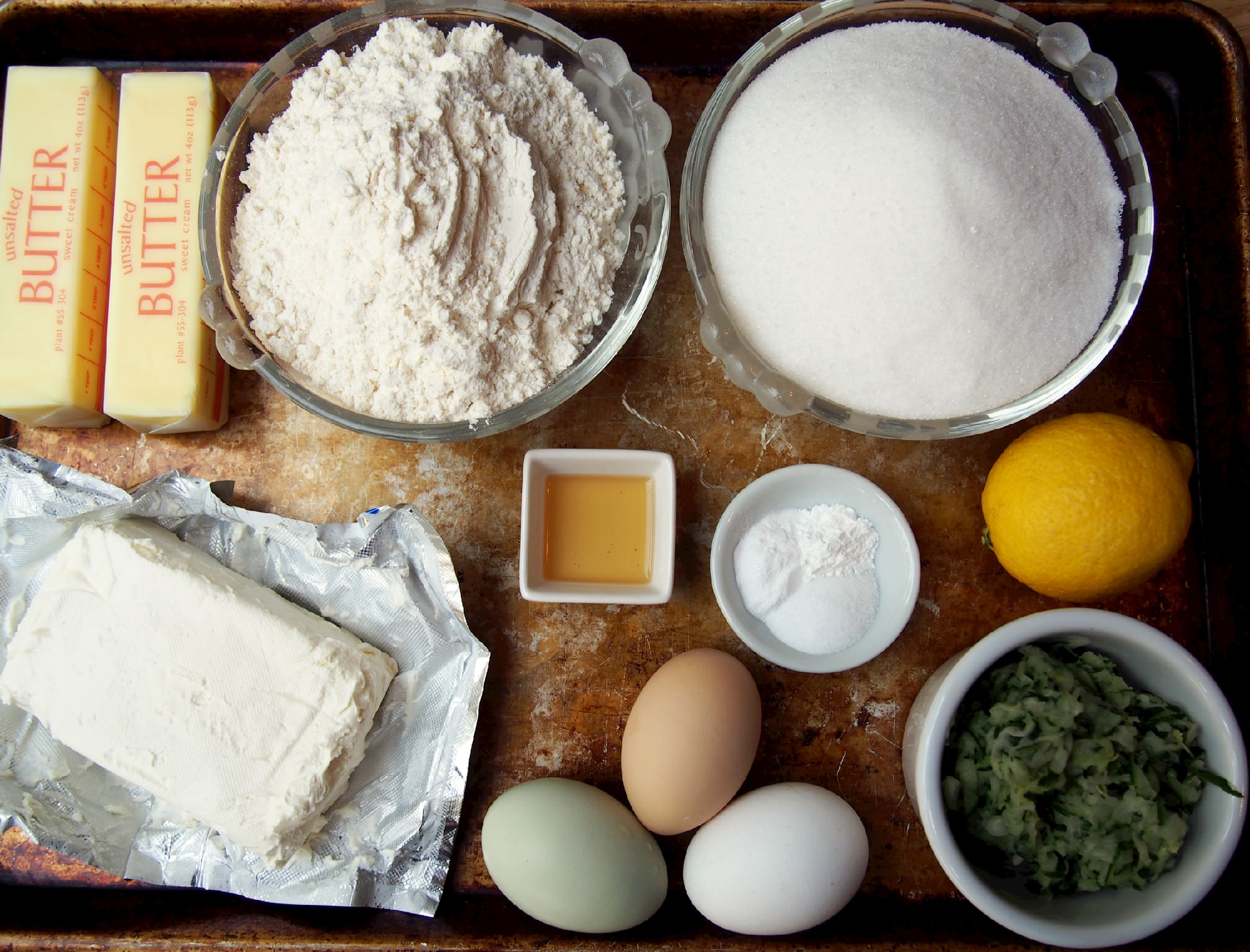 Ingredients to make zucchini bundt cake with lemon cream glaze