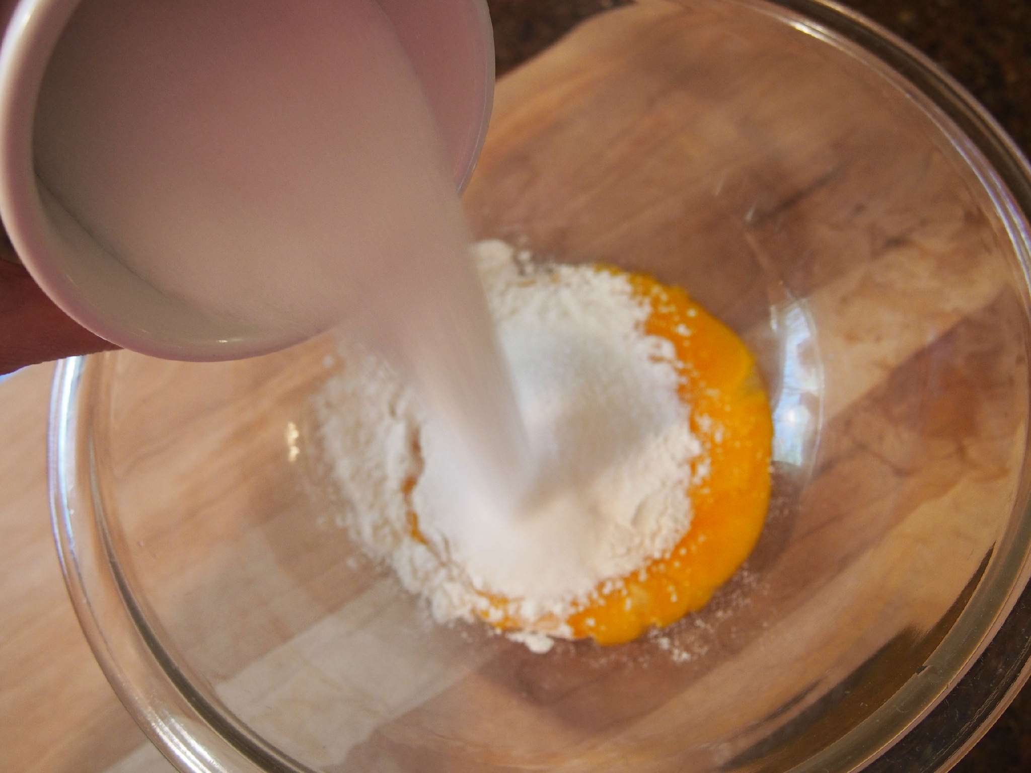 sugar into egg yolks