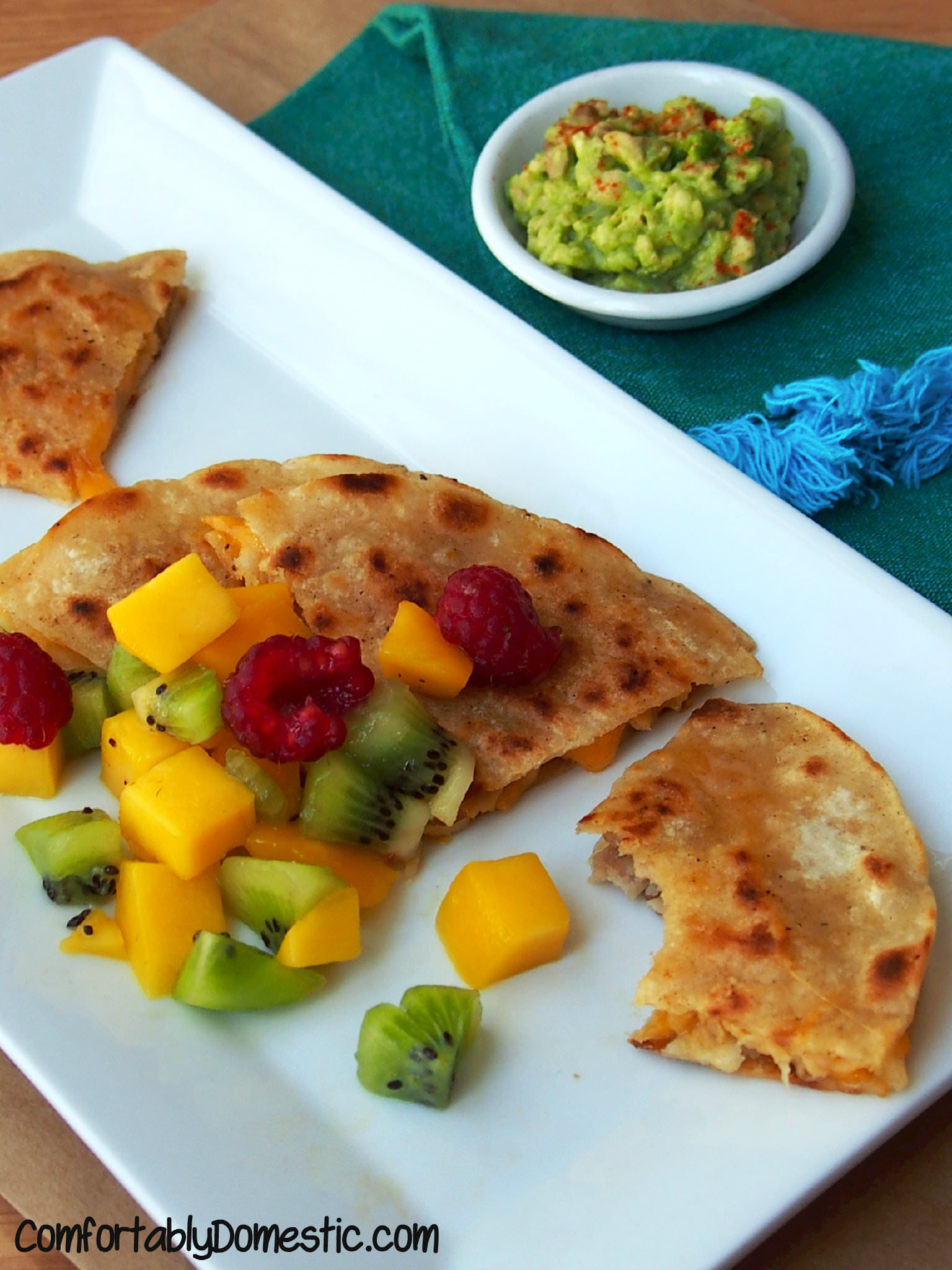 Garlic Pork Quesadillas with Mango Salsa are any easy dinner that you can make using leftovers! | ComfortablyDomestic.com