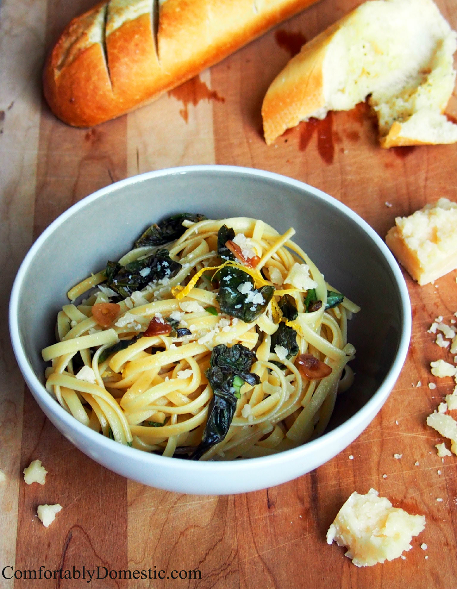 Lemon garlic linguine with kale is a delicious and easy to make weeknight dinner. Adding fresh kale gives this dish a burst of color and health benefits. | ComfortablyDomestic.com