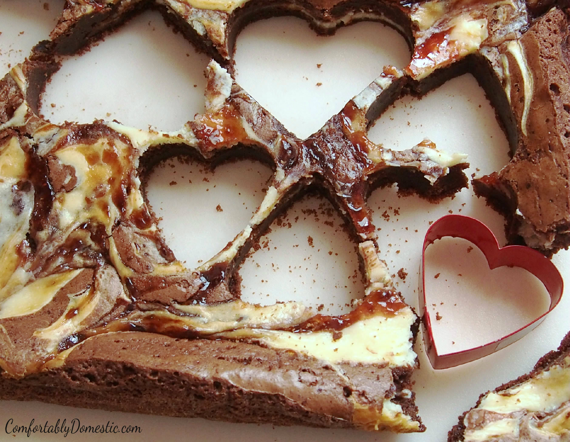 Cutting fun shapes out of Strawberry Cream Cheese Brownies | ComfortablyDomestic.com