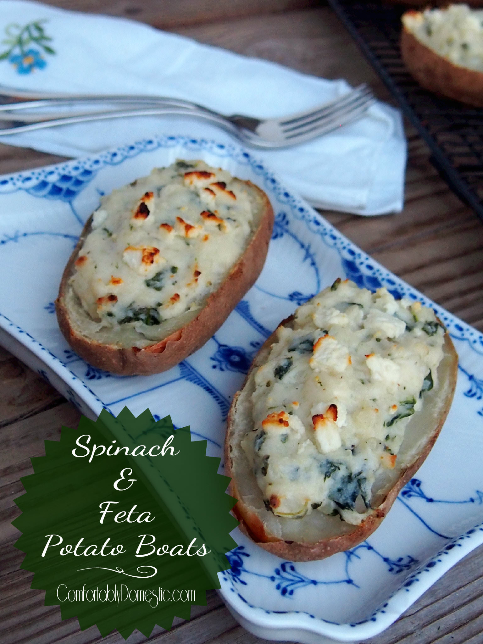 Spinach Feta Twice Baked Potato Boats are made healthier with fresh baby spinach, plain yogurt, cow’s milk feta, and Parmesan cheeses for an exciting and memorable side dish. | ComfortablyDomestic.com