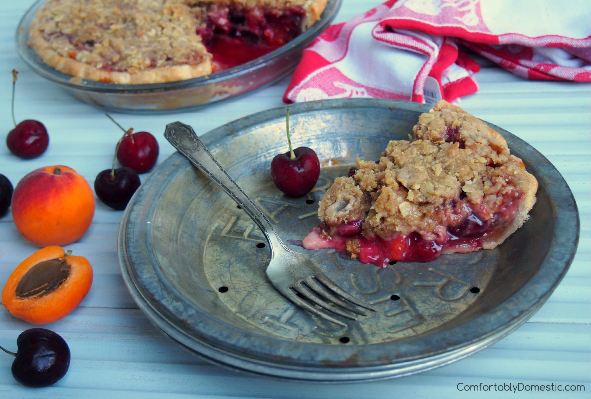 Sweet Cherry Apricot Crumb Pie blends juicy sweet cherries with with tangy apricots for a fresh burst of summer in every bite! | ComfortablyDomestic.com