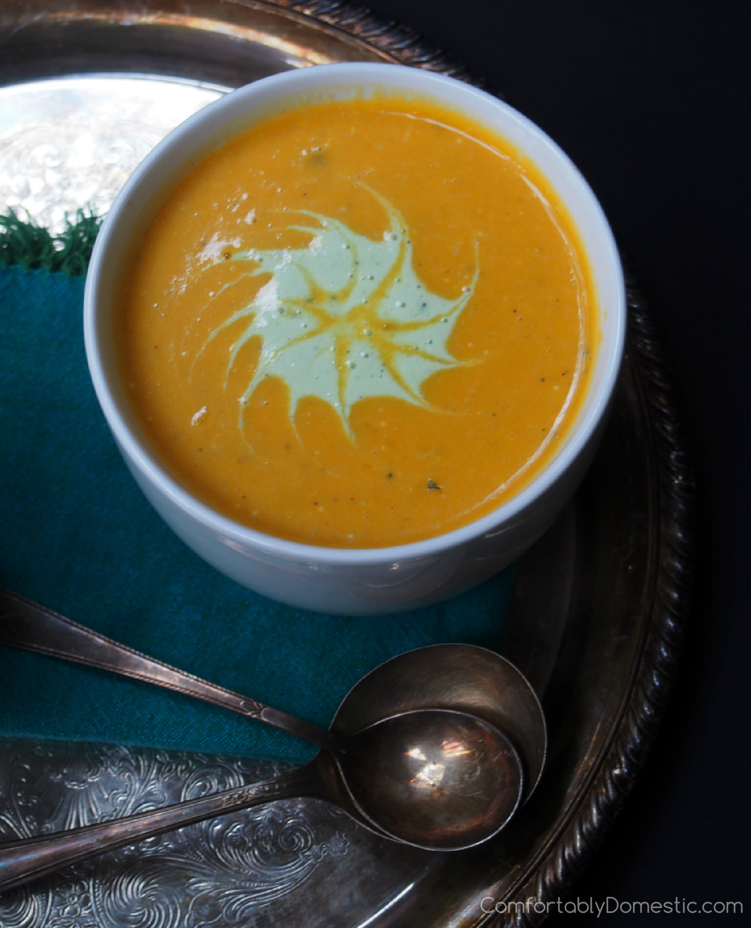 This spicy butternut squash bisque recipe blends roasted butternut squash with onion, garlic, and a bit of spice, creating velvety soup with a spicy finish. | ComfortablyDomestic.com